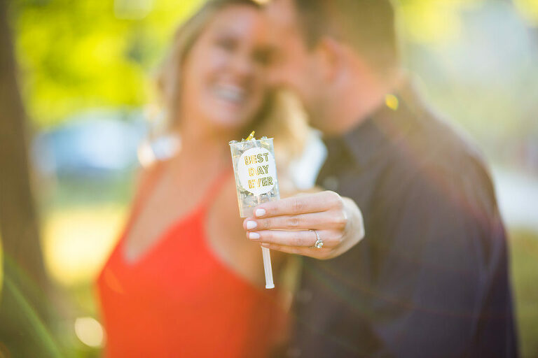 couple holding confetti popper Kaitlyn Ferris engaged 