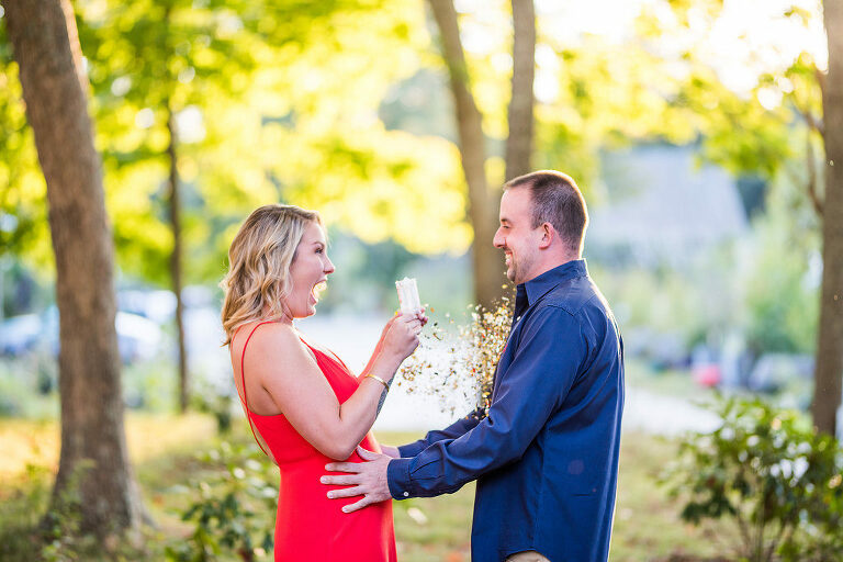 couple popping confetti Kaitlyn Ferris engaged 