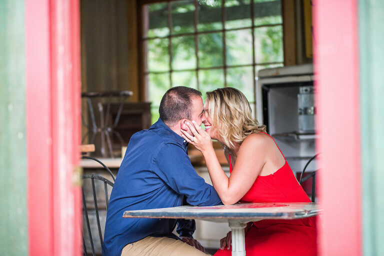 couple sitting in colorful room Kaitlyn Ferris engaged 