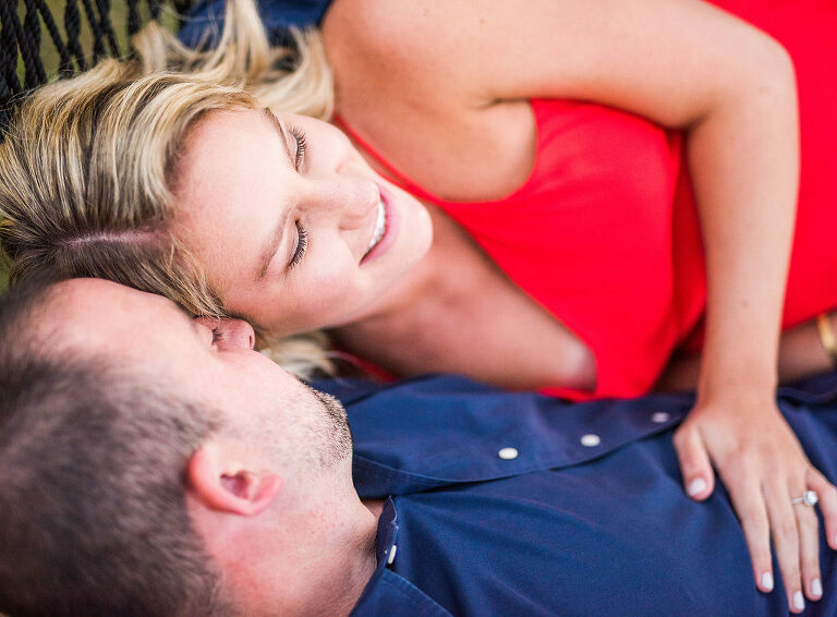 couple laying down red dress Kaitlyn Ferris engaged 