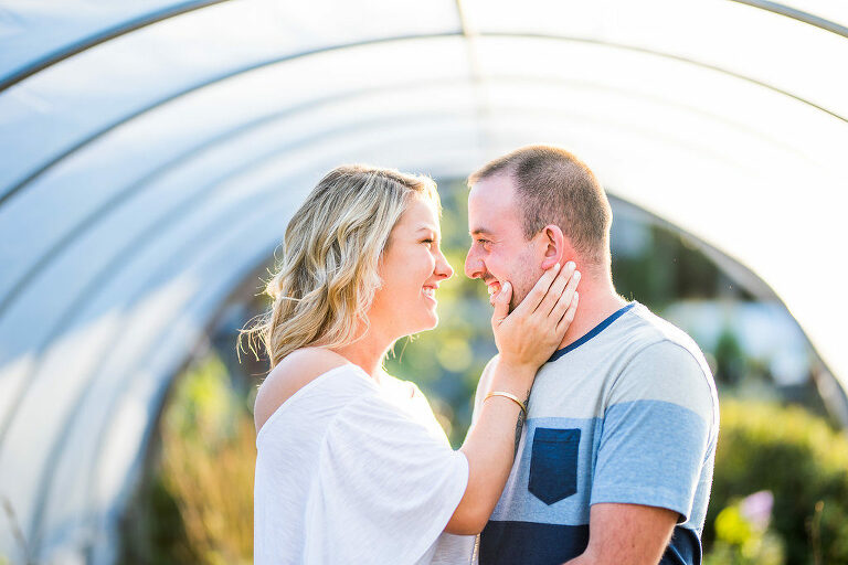 couple laughing in greenhouse Kaitlyn Ferris engaged 