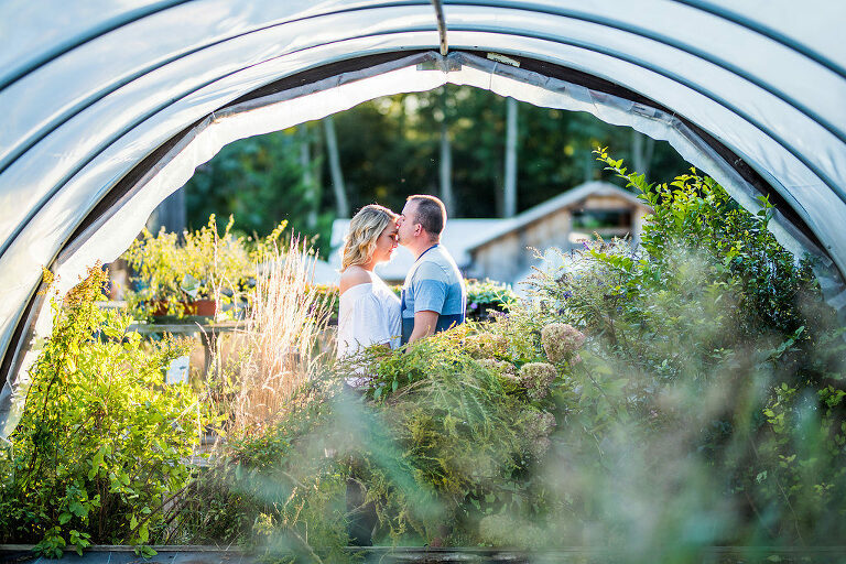 couple in background greenery Kaitlyn Ferris engaged 