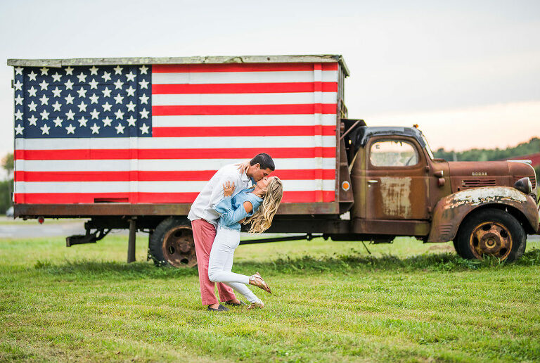 kiss American flag truck romantic engagement