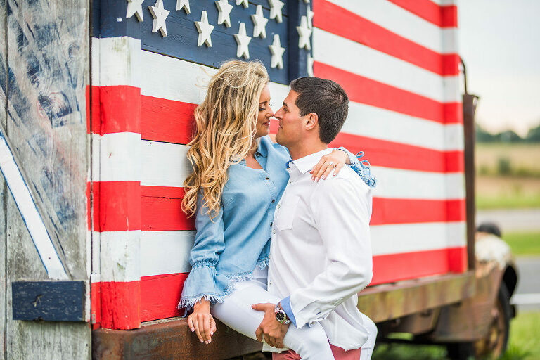 against the American flag truck romantic engagement