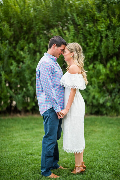 two people forehead greenery romantic engagement 