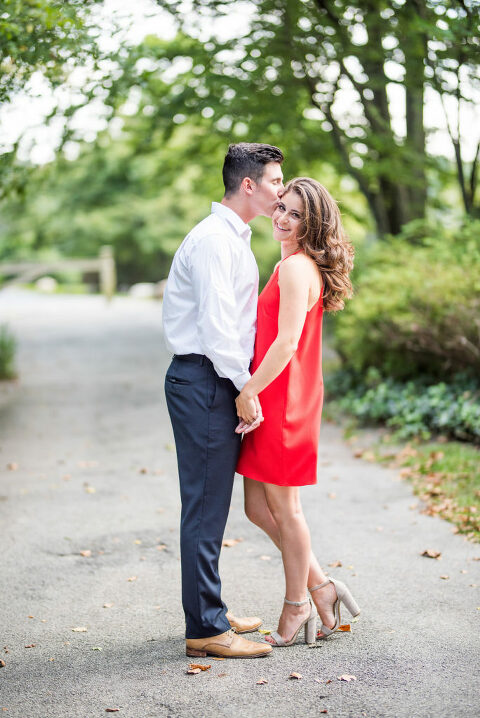 forehead kiss smile red dress summer engagement 