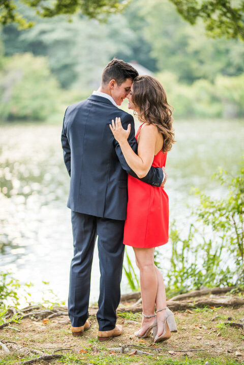 looking at each other red dress summer engagement 