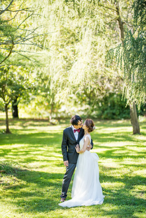 standing under a tree bride and groom Kaitlyn Ferris photography garden wedding