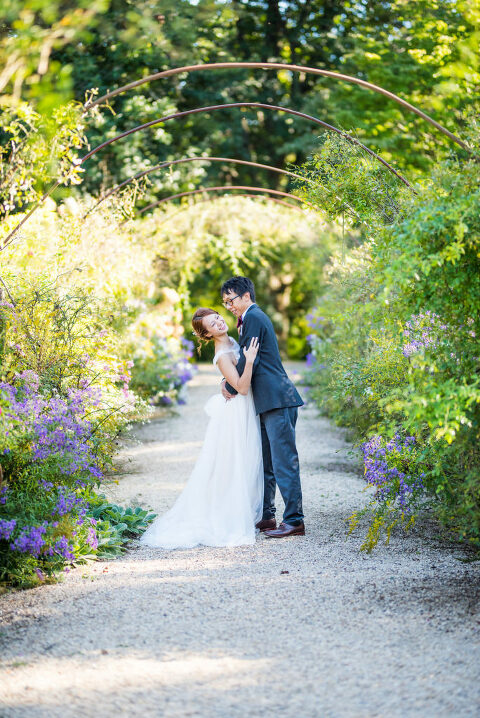 bride and groom laughing under metal arbor Kaitlyn Ferris photography garden wedding