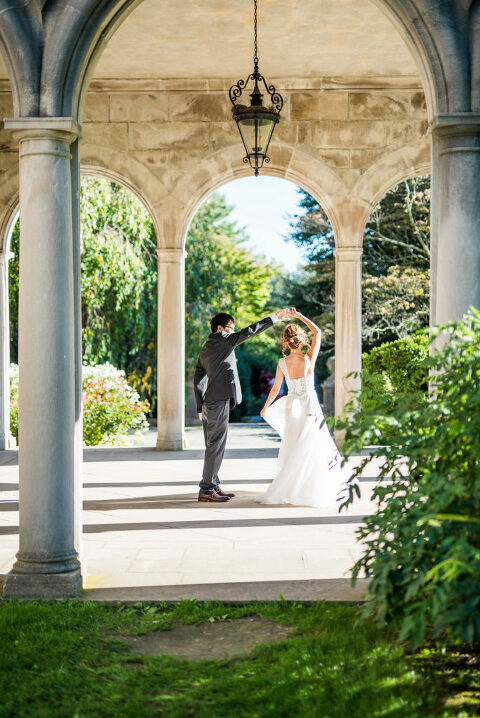 bride and groom twirling Kaitlyn Ferris photography garden wedding