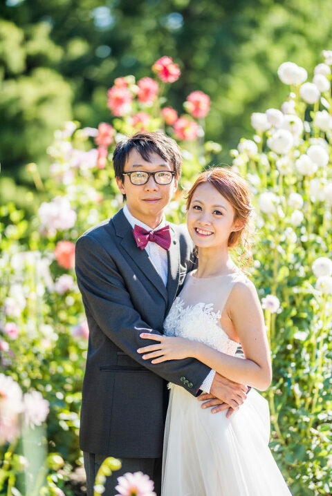couple in front of flowers garden wedding